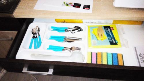 a sink with a faucet and other items in a drawer at Apartment in city center in Daugavpils