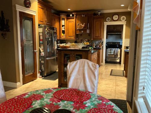 a kitchen with a table with a red table cloth on it at Barry and Elaine in Abbotsford