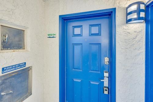 a blue door on the side of a building at Pets welcome,direct oceanfront, poolside,1 bedroom in Myrtle Beach