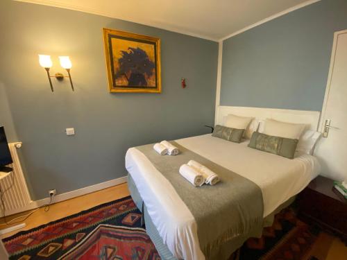 เตียงในห้องที่ Saint Lambert Terrace