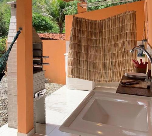 a bathroom with a sink and a shower at CASA da CHi in Piranhas
