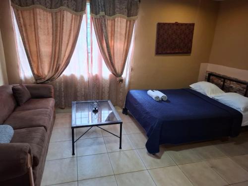 Legado Residence客房内的一张或多张床位