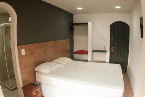 Una cama o camas en una habitación de Pousada Casa Maré