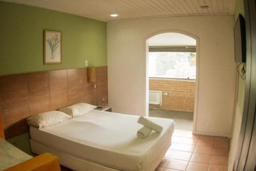 Ένα ή περισσότερα κρεβάτια σε δωμάτιο στο Pousada Casa Maré