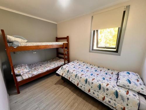 Ένα ή περισσότερα κρεβάτια σε δωμάτιο στο Cabaña Rapha