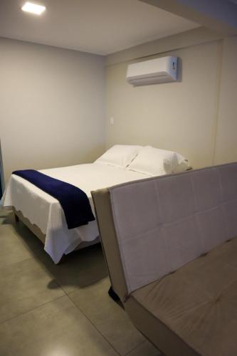 Ένα ή περισσότερα κρεβάτια σε δωμάτιο στο Catamarã Pé na Areia