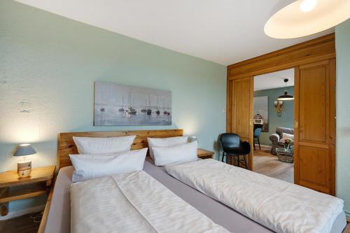 En eller flere senge i et værelse på Landhaus Ostseeblick Fewo 10-