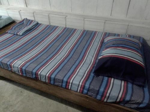 Ένα ή περισσότερα κρεβάτια σε δωμάτιο στο Hostal ladrillerossurf