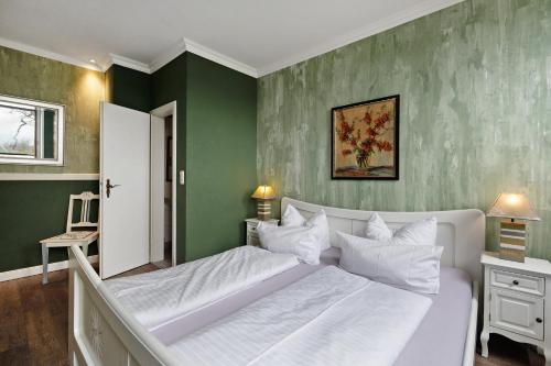 En eller flere senge i et værelse på Landhaus Ostseeblick Fewo 6 -