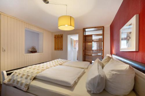 En eller flere senge i et værelse på Landhaus Ostseeblick Fewo 7 -