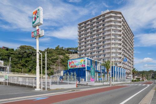 a building on the side of a city street at HOTEL R9 The Yard Katsura in Katsuura