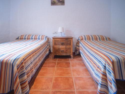 Postel nebo postele na pokoji v ubytování Chalet in El Palmar by the Beach