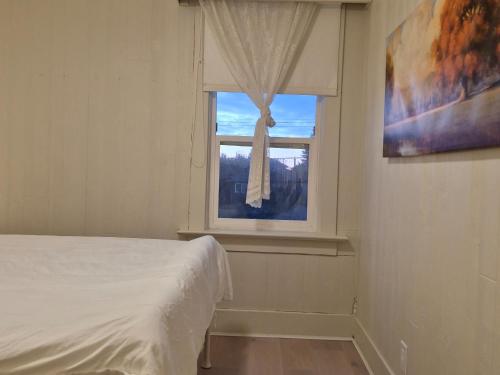 Ένα ή περισσότερα κρεβάτια σε δωμάτιο στο John's House in Vancouver West