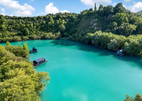 an aerial view of a river with boats on it at St Andrews Lakes in Halling