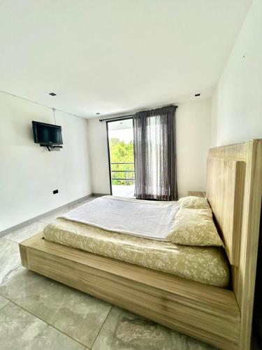 เตียงในห้องที่ Finca mi Rancho