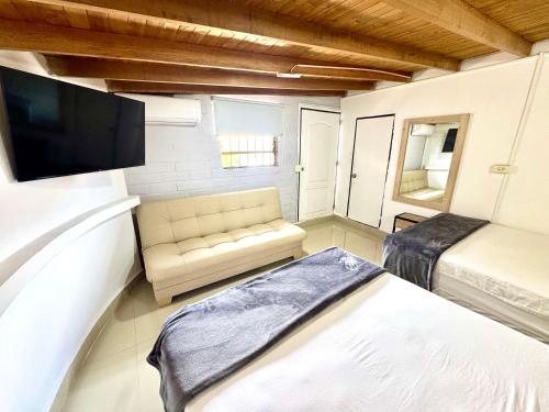 Ένα ή περισσότερα κρεβάτια σε δωμάτιο στο Hotel Estadio 80