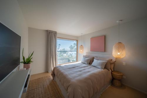 Ένα ή περισσότερα κρεβάτια σε δωμάτιο στο Cantilever Seaview Pavilion