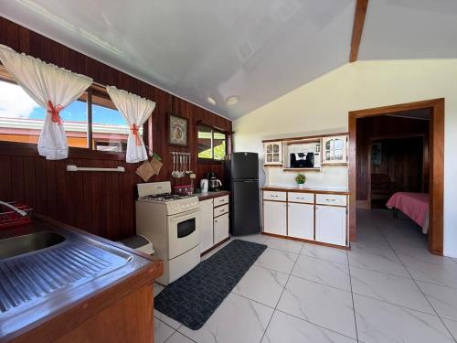 a kitchen with a sink and a stove top oven at Campo Azul #2 - Monteverde in Monteverde Costa Rica