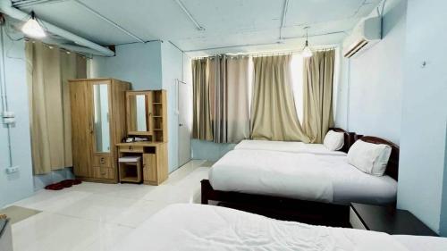 Ένα ή περισσότερα κρεβάτια σε δωμάτιο στο Jasmin Guest House