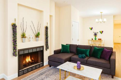 a living room with a couch and a fireplace at Soulard King 1BR w Washer & 370 Mbps Wi-Fi in Saint Louis
