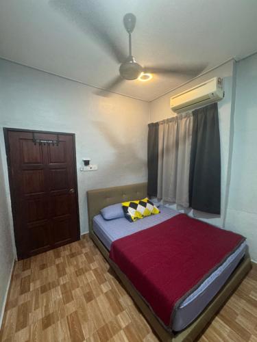 Postel nebo postele na pokoji v ubytování Twins Homestay