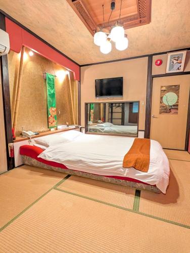 Voodi või voodid majutusasutuse 南の楽園 toas