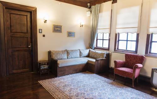 a living room with a couch and a chair at Uğurlu Konakları in Kastamonu