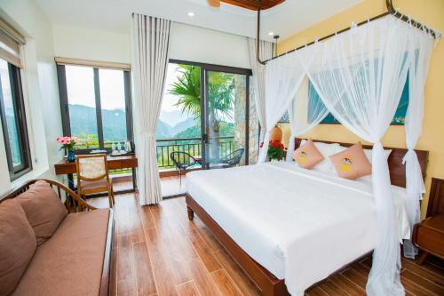 Ένα ή περισσότερα κρεβάτια σε δωμάτιο στο Central Hills Pu Luong Resort