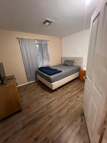 a small bedroom with a bed and a window at West Phoenix Value Room 1 Bennet in Phoenix
