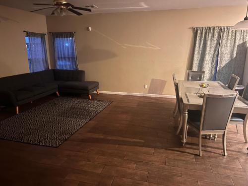 a living room with a couch and a table at West Phoenix Value Room 1 Bennet in Phoenix