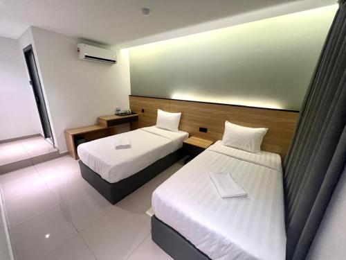 Postel nebo postele na pokoji v ubytování Hotel M9 Sepang KLIA & KLIA 2