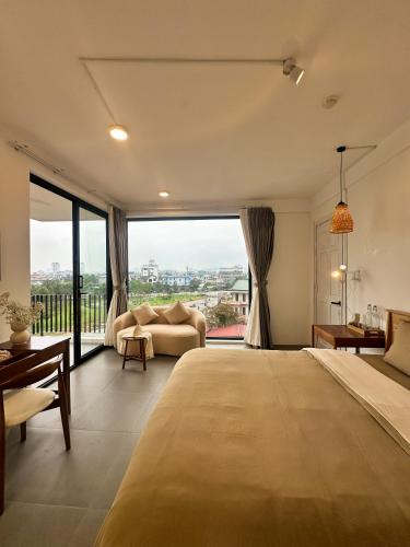 Ένα ή περισσότερα κρεβάτια σε δωμάτιο στο Inner Home Huế - Phạm Văn Đồng