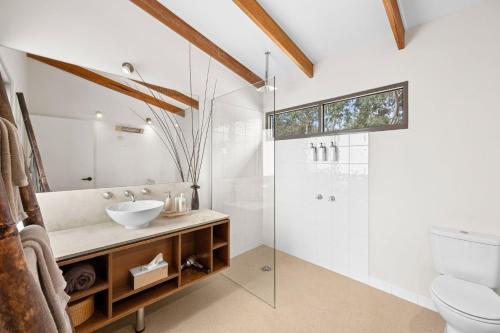 a bathroom with a sink and a shower at Bellbrae Harvest in Torquay