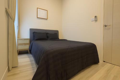 Ένα ή περισσότερα κρεβάτια σε δωμάτιο στο Macrolink Medini Signature Suite near Legoland by Our Stay