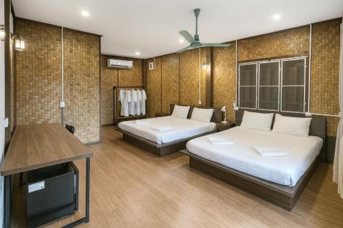 Postel nebo postele na pokoji v ubytování Ban Villa PhaSouk