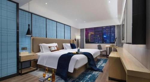 Postel nebo postele na pokoji v ubytování Echarm Hotel Changchun Jiutai District Government Railway Station