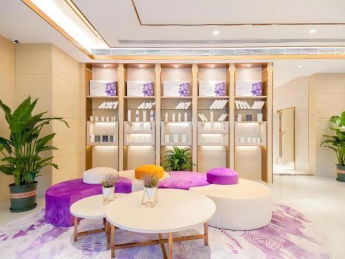 a dressing room with purple and white tables and shelves at Lavande Hotel Beijing Fangshan Changyang Metro Station in Pei-kang-wa