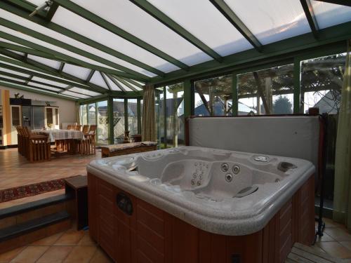 a jacuzzi tub in the middle of a house at Villa in Middelkerke near the Beach in Middelkerke