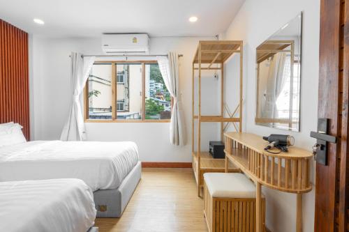 Postel nebo postele na pokoji v ubytování The Banyan House