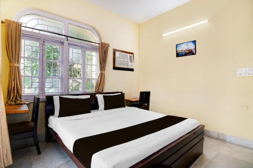 Postel nebo postele na pokoji v ubytování Super Collection O Jyotirindra Nandi Metro Station Kolkata Formerly Hotel Manurama