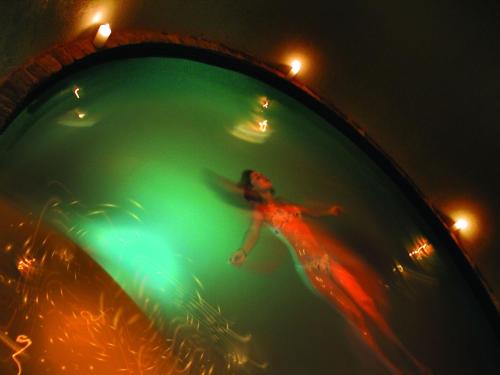 a woman in a pool of water with lights at Fordoun Hotel and Spa in Nottingham Road