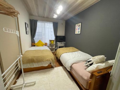 Ένα ή περισσότερα κρεβάτια σε δωμάτιο στο サイプレス平岸