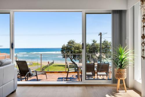 a living room with a view of the ocean at The Rotunda, Gerroa in Gerroa