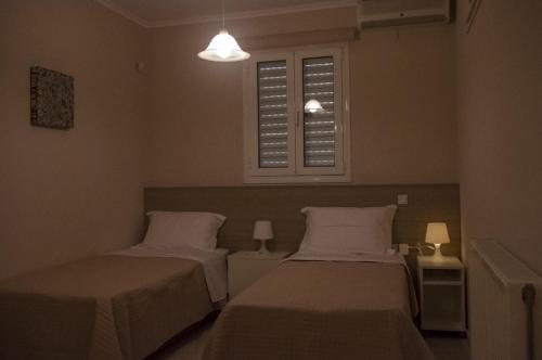 Ένα ή περισσότερα κρεβάτια σε δωμάτιο στο Horizon Villa Kampani
