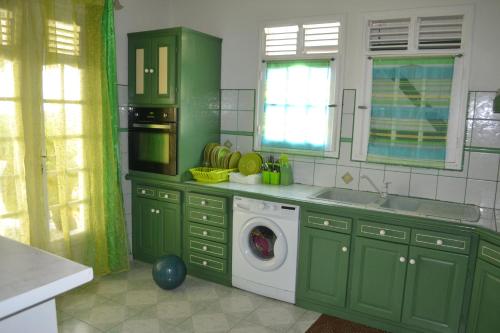 Virtuvė arba virtuvėlė apgyvendinimo įstaigoje La Nicotoria HAUT DE VILLA T4