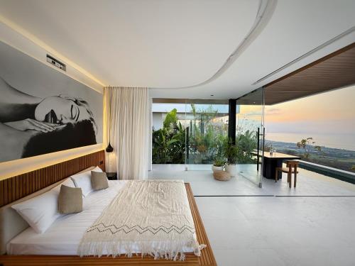 Ένα ή περισσότερα κρεβάτια σε δωμάτιο στο Baliwood - Ocean View Lovina