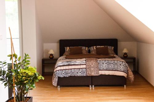 A bed or beds in a room at Penzion Conti