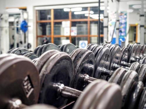 a bunch of dumbbells lined up in a gym at Abbey Court in Nenagh
