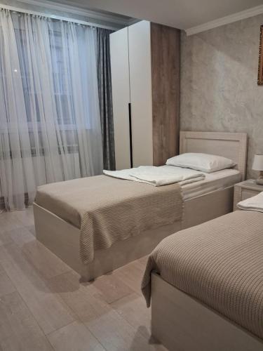 Ένα ή περισσότερα κρεβάτια σε δωμάτιο στο GarInna