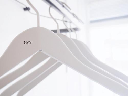 a white hanger with the word may written on it at CPH Studio Hotel in Copenhagen